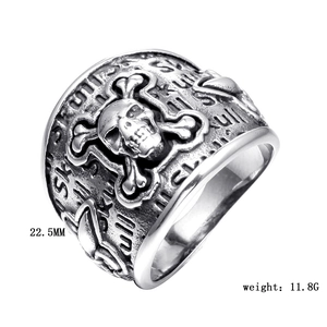 Macro view of vintage stainless steel skull ring with embossed side text and 22.5mm width