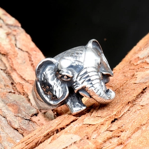 Vintage stainless steel elephant head ring for men with oxidized silver finish on wood