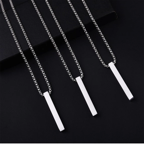 Macro detail of three polished silver vertical bar pendants with a smooth mirror finish
