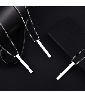 Polished silver titanium vertical bar pendant with box chain on a black background