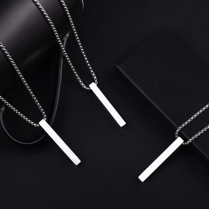Polished stainless steel rectangular pillar pendant necklaces on black background