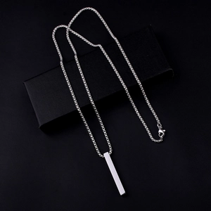 Minimalist silver stainless steel pillar pendant necklace on black gift box display
