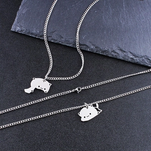 Close-up of stainless steel cat silhouette pendant necklace set with delicate chain