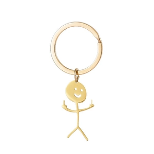 Creative golden stainless steel keychain featuring a humorous middle finger stickman pendant