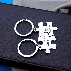 Stainless steel puzzle piece keychain set with Better Together engraving and heart icons