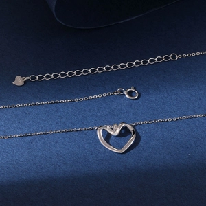 Elegant S925 sterling silver hollow heart pendant necklace with adjustable chain