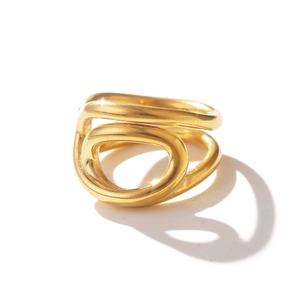 Macro detail of gold layered crossover knot ring with a minimalist sculptural design