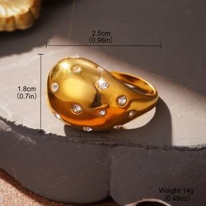 French design double-layer knot gold ring with clear zircons on grey stone display
