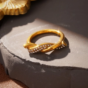 Detail of gold-plated knot ring featuring sparkling micro-pave cubic zirconia stones