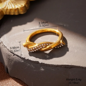 Detail view of gold knotted ring showing dimensions of 2.34cm diameter and 5.4g weight