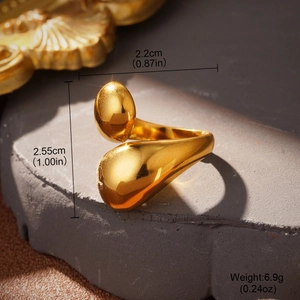 Detailed view of gold knot ring dimensions and polished organic teardrop design