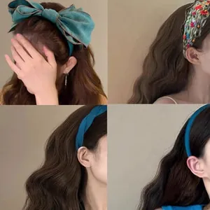 Detail view of premium teal fabric headband with delicate floral embroidery for women