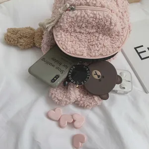 Mini sac à dos en laine d'agneau rose pour enfants avec fermeture éclair et gland