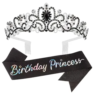 Detailed view of silver alloy crown with black rhinestones and birthday princess sash