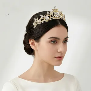 Close-up of golden Baroque bridal crown with sparkling heart rhinestones on a model