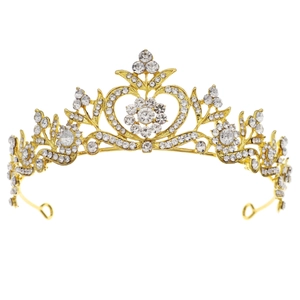 Golden baroque bridal crown with heart-shaped crystal center and intricate filigree work