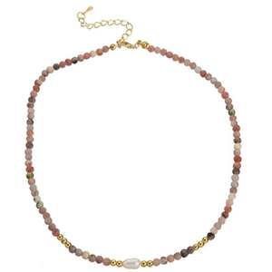 Detailed shot of agate bead necklace with baroque pearl and golden lobster clasp