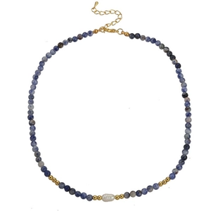 Detailed view of handmade necklace with blue agate beads, white pearl and golden clasp