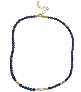 Detailed close-up of beaded necklace with blue stones, gold spacers and a baroque pearl