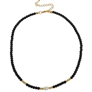 Detail of beaded necklace with irregular pearl and adjustable gold lobster clasp