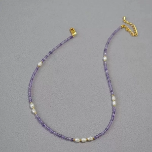 Handmade beaded necklace featuring purple amethyst, freshwater pearls and gold lobster clasp