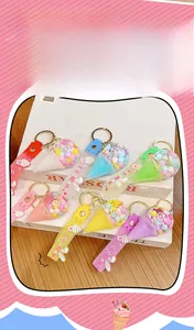 Close-up of colorful ice cream floating bottle keychains with silicone wrist straps
