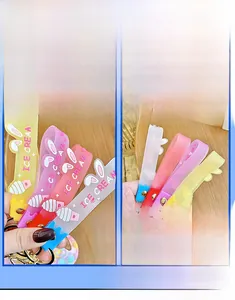 Detail of colorful ice cream themed silicone hand straps with cute 3D bunny ears