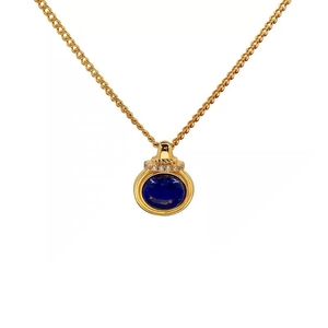 Vintage gold necklace with round lapis lazuli pendant and sparkling crystal details