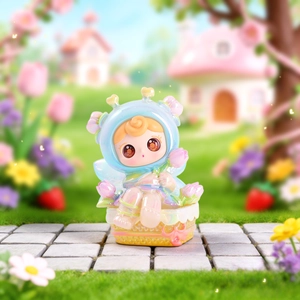 Close-up view of a cute pearlescent cartoon fairy figure ornament in a flower basket.