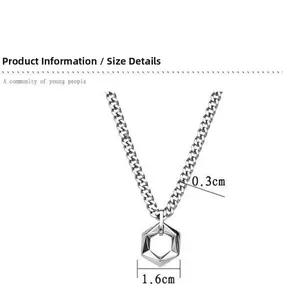 Detail view of silver hexagon pendant on a thick Cuban chain with OT buckle