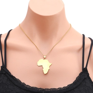 Minimalist gold necklace with Africa map pendant displayed on mannequin