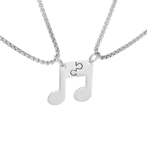 Vue détaillée du collier puzzle note de musique en acier inoxydable argenté pour couples