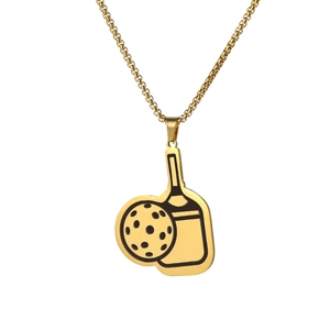 Detail of a golden pickleball paddle necklace with a box chain on a white background