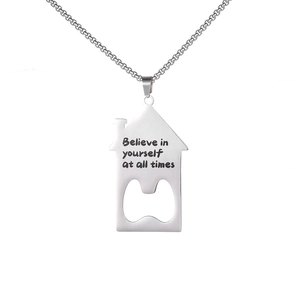 Detail view of silver house-shaped necklace pendant with bottle opener and quote