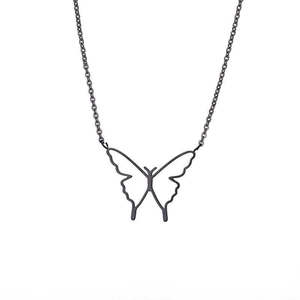 Close-up of black hollow butterfly pendant necklace with elegant fine chain details
