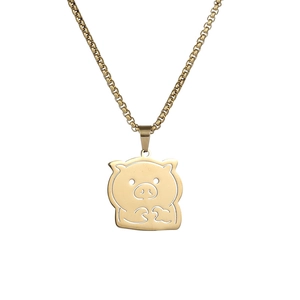 Macro de l'intérieur du collier cochon doré évidé minimaliste avec finition polie