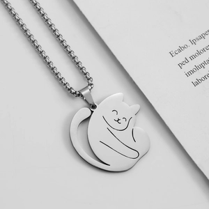 Minimalist stainless steel cat pendant necklace with polished silver finish on white background