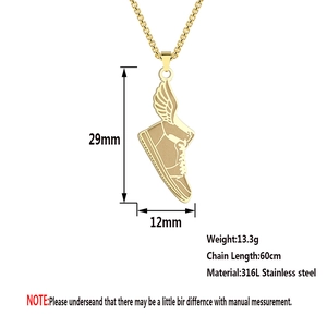 Close-up of golden 316L stainless steel winged sneaker pendant with 60cm chain
