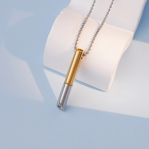 Mindfulness breathing necklace with two-tone gold and silver cylinder pendant