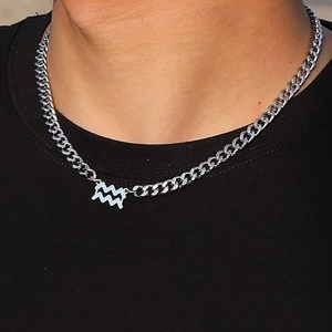 Fashionable stainless steel Cuban chain necklace with an Aquarius zodiac pendant on a model