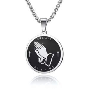 Polished stainless steel praying hands necklace with One Day at a Time round pendant