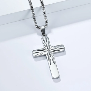 Men's minimalist stainless steel cross necklace with sunburst engraving on a box chain