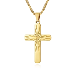 Detailed macro view of a gold stainless steel cross pendant with starburst engraving
