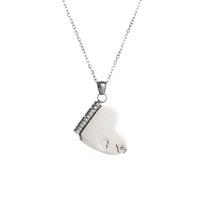 Detailed view of the stainless steel heart locket pendant with openable hinge and cutout