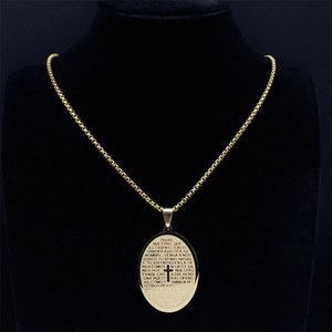Vintage gold oval cross necklace with Spanish Lord's Prayer engraving on black mannequin