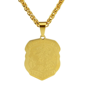 Close-up of golden Saint Michael shield pendant with detailed relief and braided chain