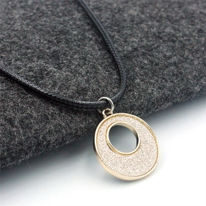 Minimalist geometric round pendant necklace with gold frame and silver glitter finish