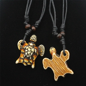 Handcrafted sea turtle resin necklace with adjustable black wax cord and wooden beads