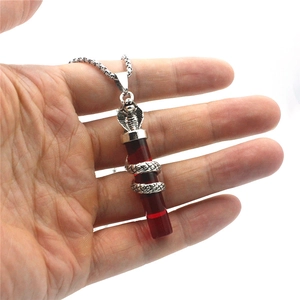 Men's punk cobra pendant necklace with a translucent red resin cylinder and silver metal chain