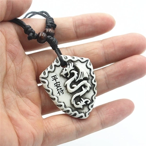 Shield-shaped dragon necklace with white resin pendant and black woven cord